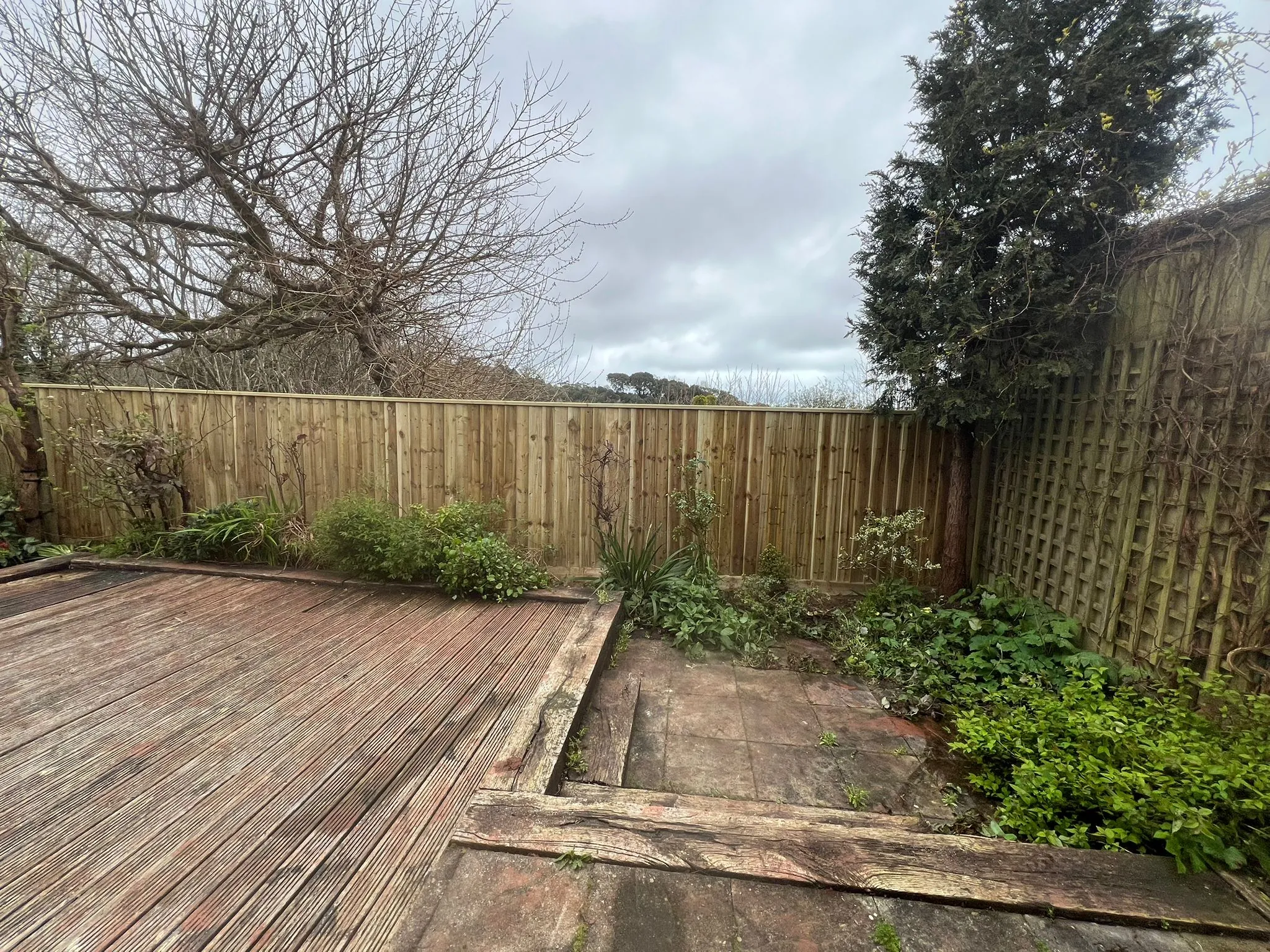 Feather-board fence construction in progress