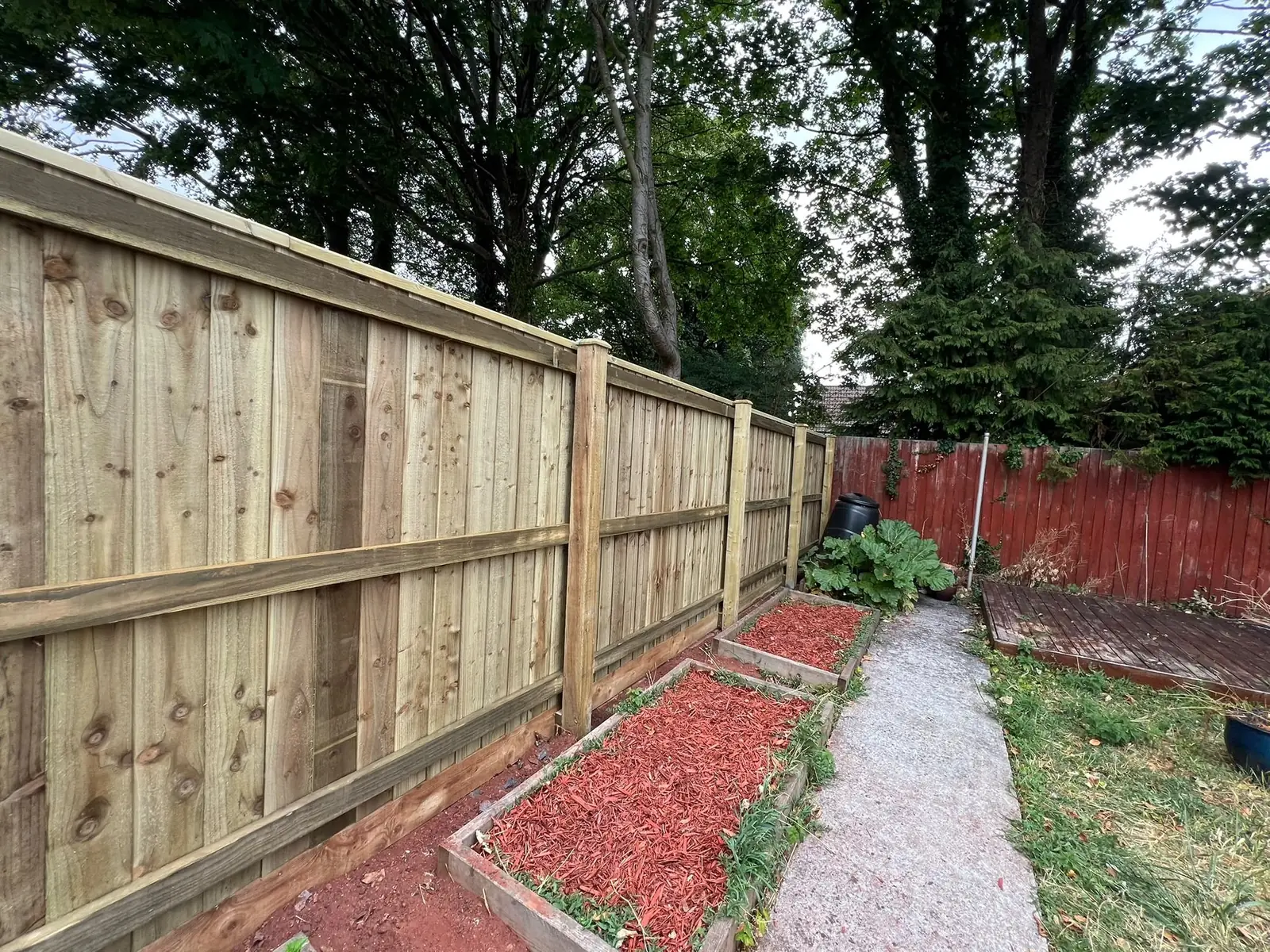 The completed fence from a wider view, showing the full 11.5 metre run.