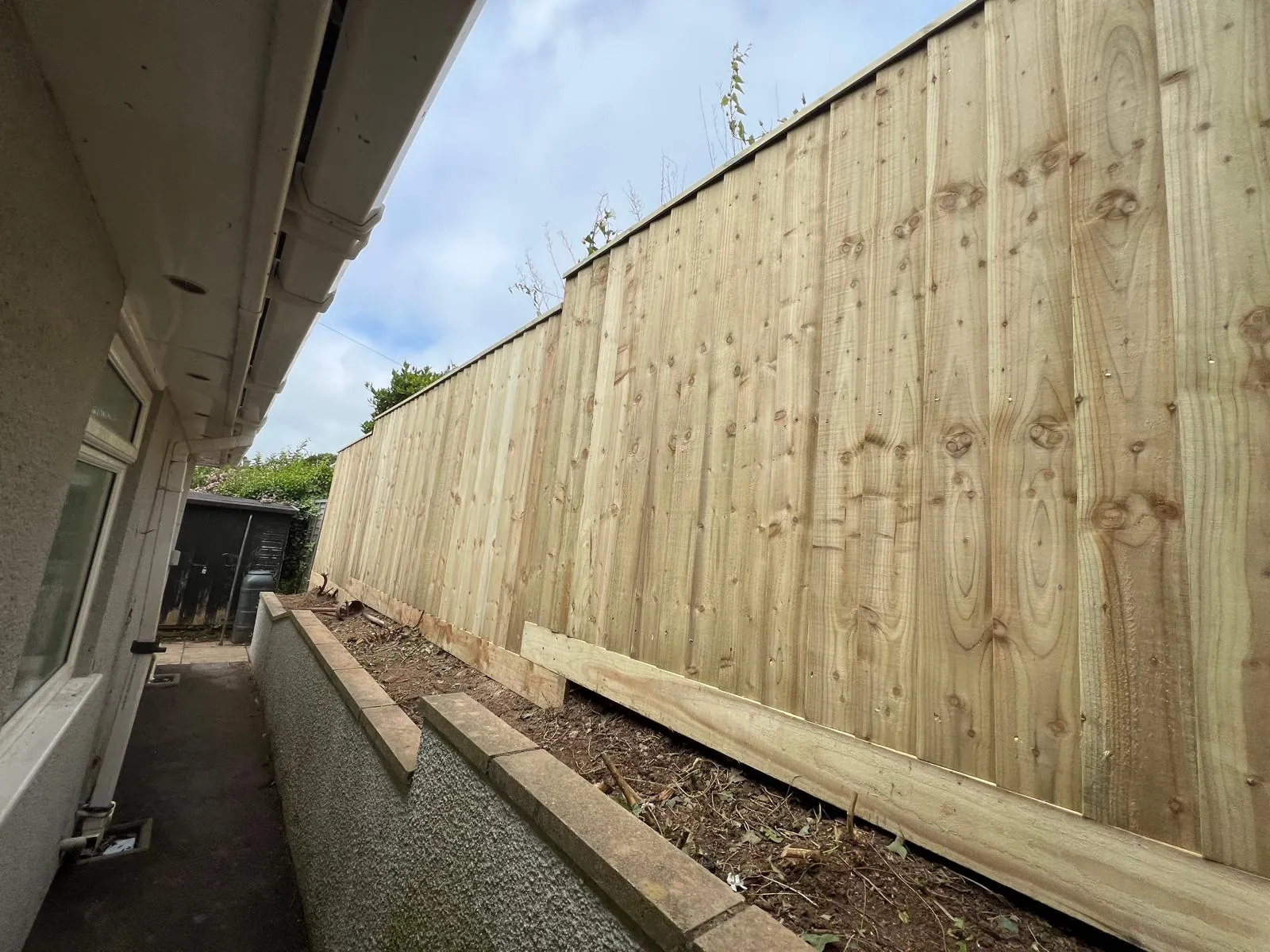 Closeboard fence installation in progress, Torquay