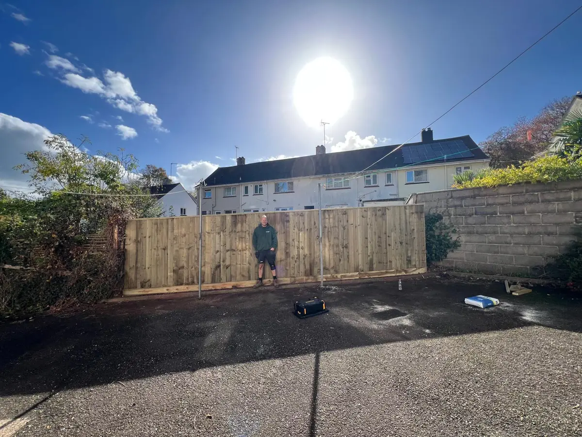 Full 7m run of new 6ft featherboard fencing in Torbay, seen from the tarmac parking area