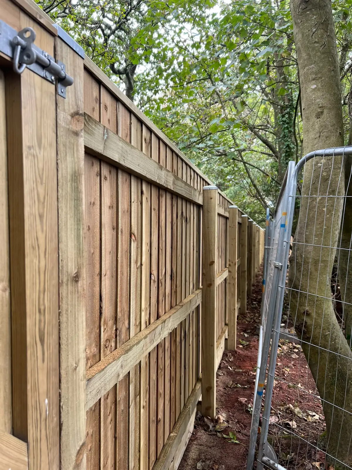 Pedestrian gate with a bolt in a new 2m featherboard fence in Wellswood, Torquay